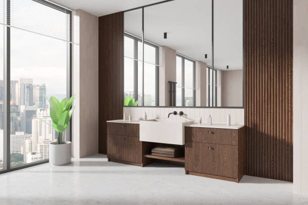 istock Stylish home bathroom interior with sink and vanity, accessories and window 2190202326