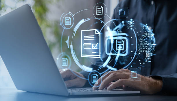 istock Digital document management concept with futuristic holographic icons. 2190202379