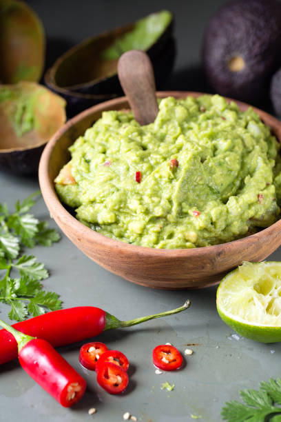 istock Guacamole in wood bowl 2190202686