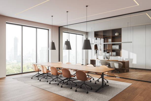 istock Modern office interior with wooden table and chairs, workplace and window 2190203273