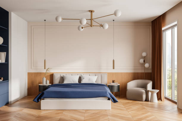 istock Modern bedroom interior with a large bed, elegant lighting, and wooden flooring in a contemporary apartment. 3D Rendering 2190204135