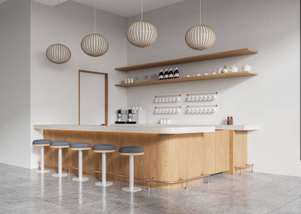 istock Modern minimalist cafe interior design with wooden bar counter and stools in neutral tones. 3D Rendering 2190204238