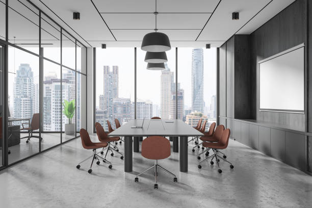istock Modern conference room with large board table and chairs, city skyline visible through glass windows. 3D Rendering 2190204264