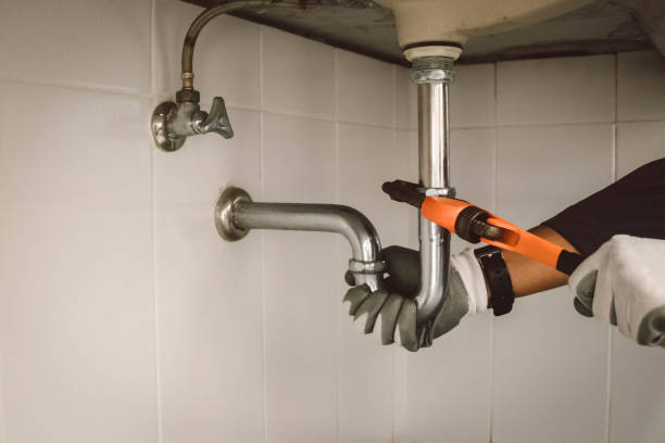 istock plumber at work in a bathroom, plumbing repair service , fix water plumbing leaks, replace the kitchen sink drain 2190204568