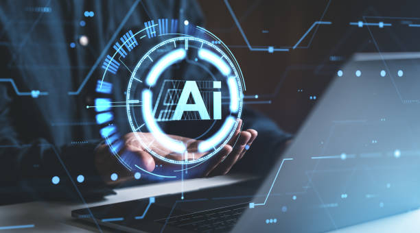 istock Futuristic holographic AI icon above laptop, glowing blue light, technological background, concept of innovation and future tech 2190204639