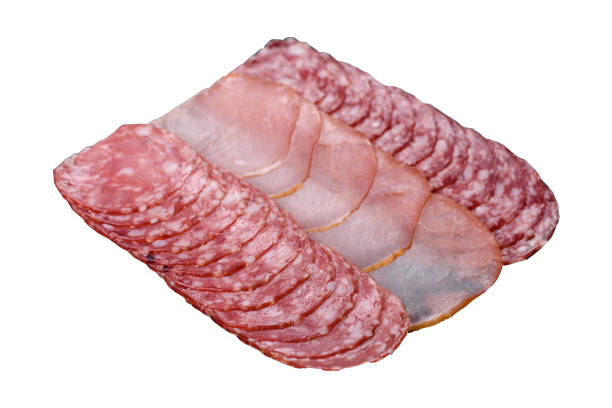 Delicious fresh smoked sausages cut with slices on a white background