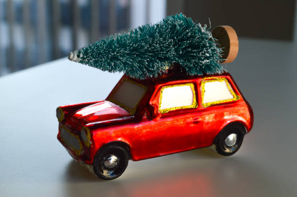 istock New Year's Ornament: Red Car with a Christmas Tree on the Roof 2190204984