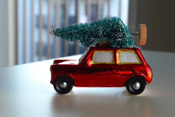 istock New Year's Ornament: Red Car with a Christmas Tree on the Roof 2190204987