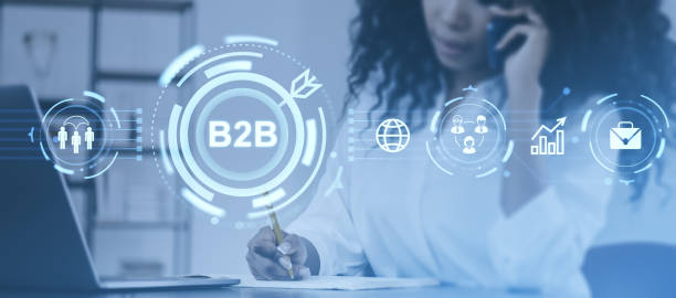 istock Businesswoman on phone with B2B technology icons and graphics ov 2190205191