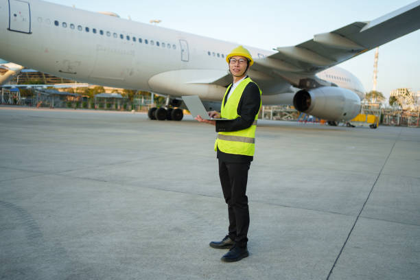 istock Asian aircraft engineer holding laptop 2190205633