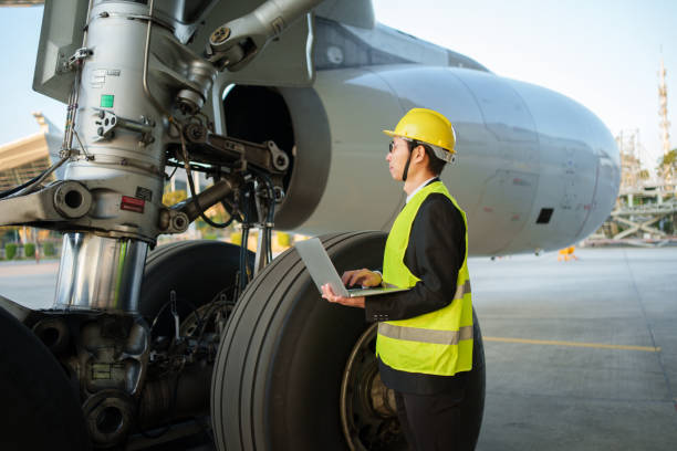 istock Engineer inspecting aircraft landing gear 2190205716