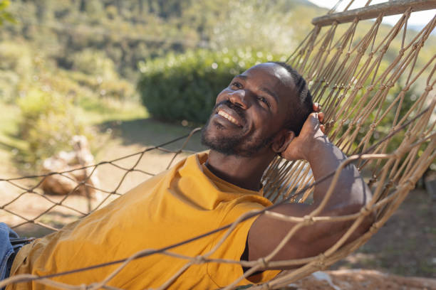istock Man enjoying nature, resting on a hammock during a glamping vacation in Europe 2190207113