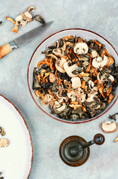 istock A large assortment of aromatic dried forest mushrooms on a plate. 2190210370