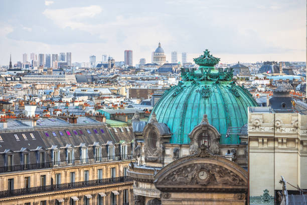 Urban skyline of Paris, France under the cloudy sky, townscape with old and modern architecture