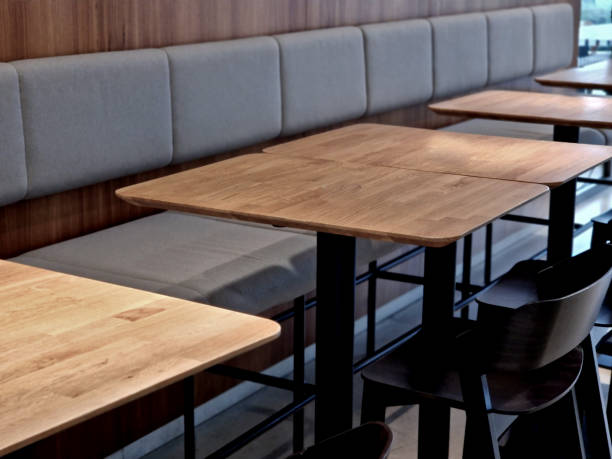 istock suede upholstered dining table chairs. wooden table and floor in the cafe 2190212310