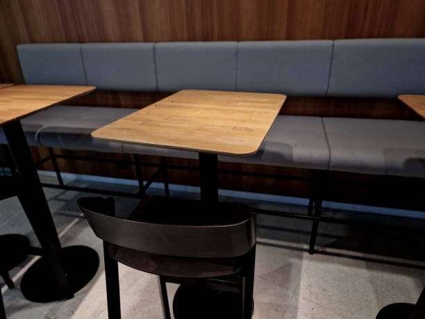 istock suede upholstered dining table chairs. wooden table and floor in the cafe 2190212347