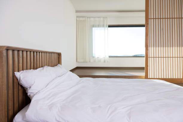 istock bed and blanket in a bedroom 2190212453
