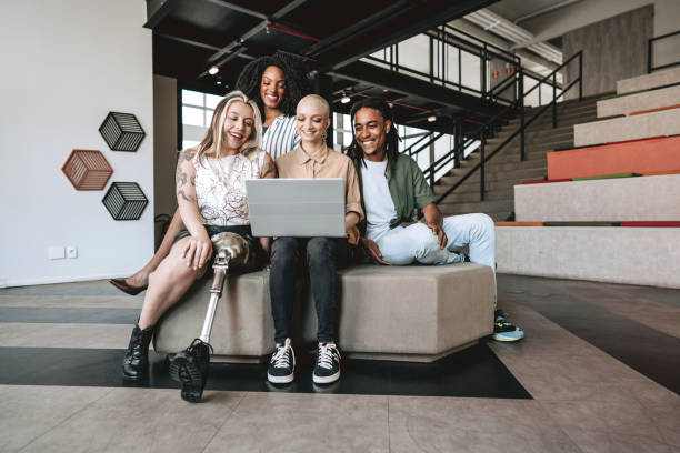 istock Group of coworkers looking at laptop 2190213767