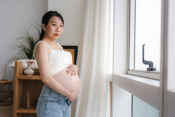 istock Embracing Motherhood: A Young Asian Woman's Journey at Home 2190214486
