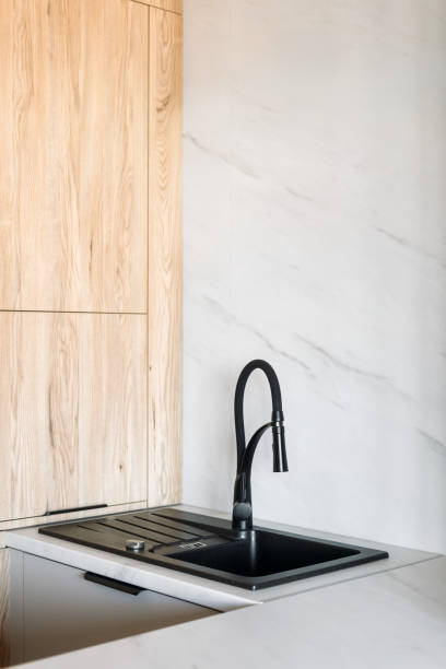 istock Modern black sink and faucet design in a stylish kitchen interior 2190215975