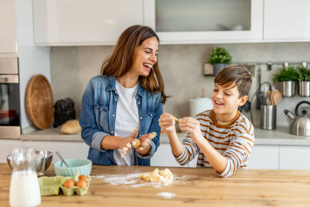 istock Mother and son bonding over cookie baking in the kitchen, sharing joy and making cherished memories 2190221432