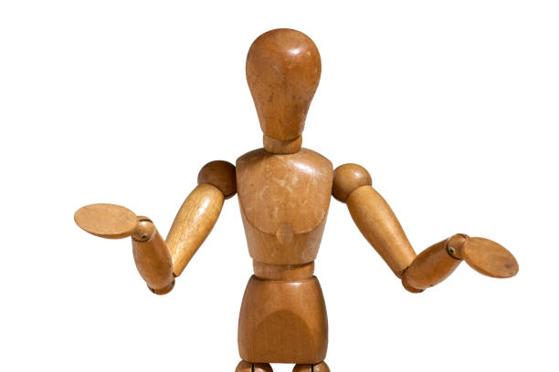 istock Wooden dummy posing against white background 2190222807