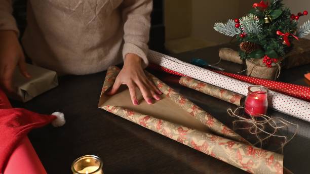 istock Wrapping gifts during holiday preparation 2190223479