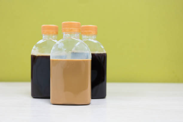 A one bottle of ice black coffee and two coffee latte bottles. Refreshing cold beverage a crisp and energizing taste in clear plastic bottle. A order from online delivery.