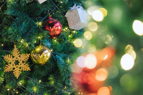 istock Holiday tree ornaments featuring glittering gold and red festive decorations Christmas and new year celebration decor 2190224768