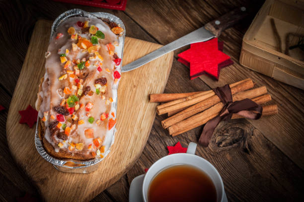 Christmas homemade fruitcake on the wodden background. Selective focus.