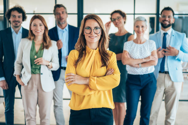 istock Confident business woman and her team 2190225250