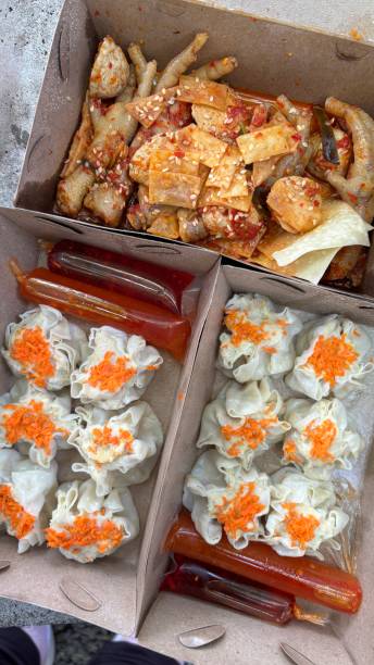 istock Chicken feet siomai and chili sauce fill takeout containers. 2190226324