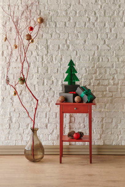 istock White brick wall background, Christmas tree, red drawer, hung ornament style interior style. 2190227267