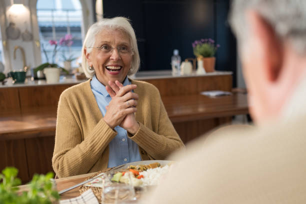 istock Smiling elderly woman engages in a lively conversation with her husband 2190227293