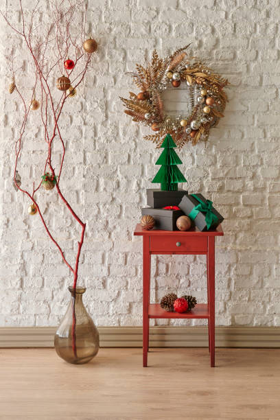 istock White brick wall background, Christmas tree, red drawer, hung ornament style interior style. 2190227364