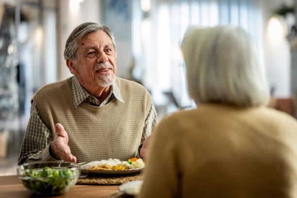 istock Elderly Couple Enjoying a Meal Together 2190227373