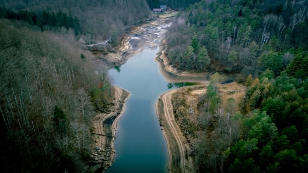 istock Aerial view of a winding river through a forest 2190227415