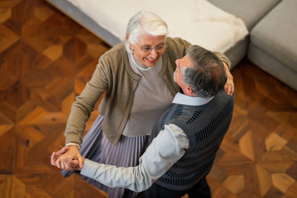 istock Elevated view of an Elderly Couple Dancing at Home 2190227907