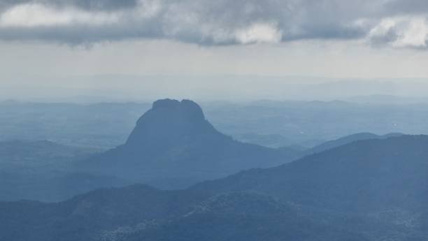 istock Misty mountain landscape with a prominent peak. 2190229026