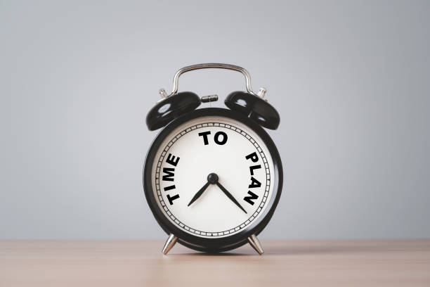 istock Black alarm clock with time to plan on table for business planing concept. 2190229389