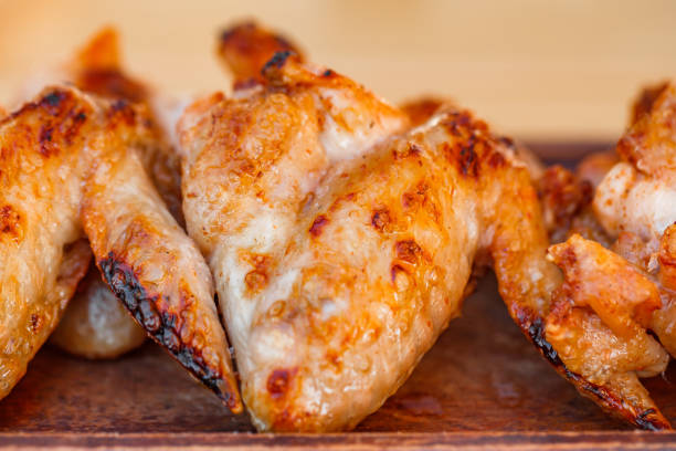 grilled BBQ chicken wings close-up, selective focus