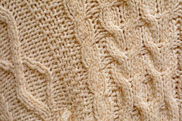 istock stylish hand-knitted light background for sewing clothes, upholstery and interior decorations color of the year 2190230102