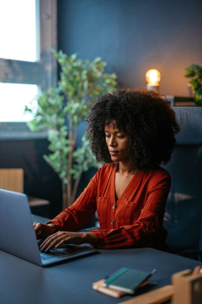istock Focused young manager working on laptop in modern office 2190232076