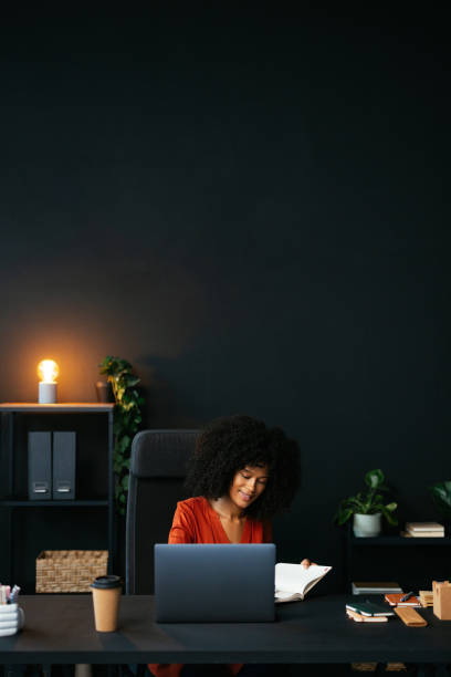 istock Young manager working at her desk in a modern office 2190232081