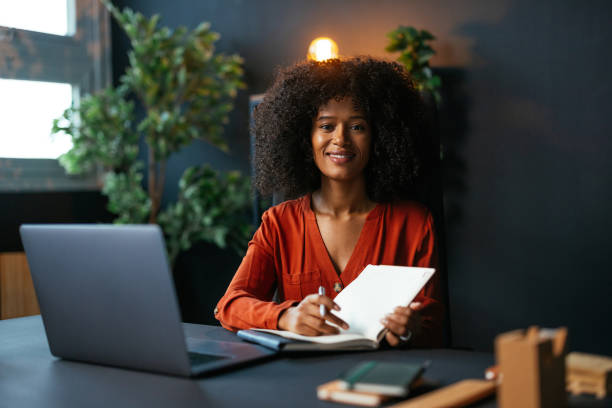 istock Young manager working with laptop and notebook at home office 2190232090