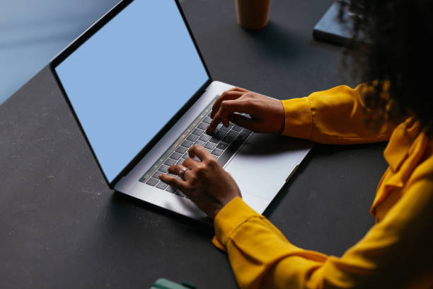 istock Freelancer working from home office typing on laptop with blue screen 2190232108