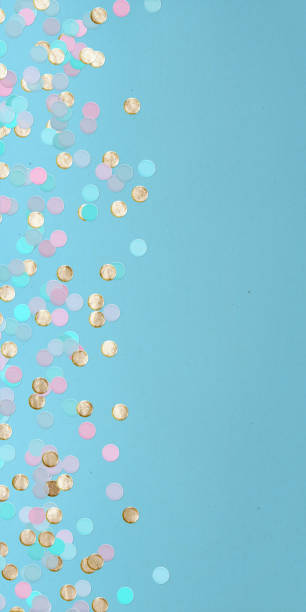 istock Colorful Recycled Confetti on Blue Paper Background 2190233287