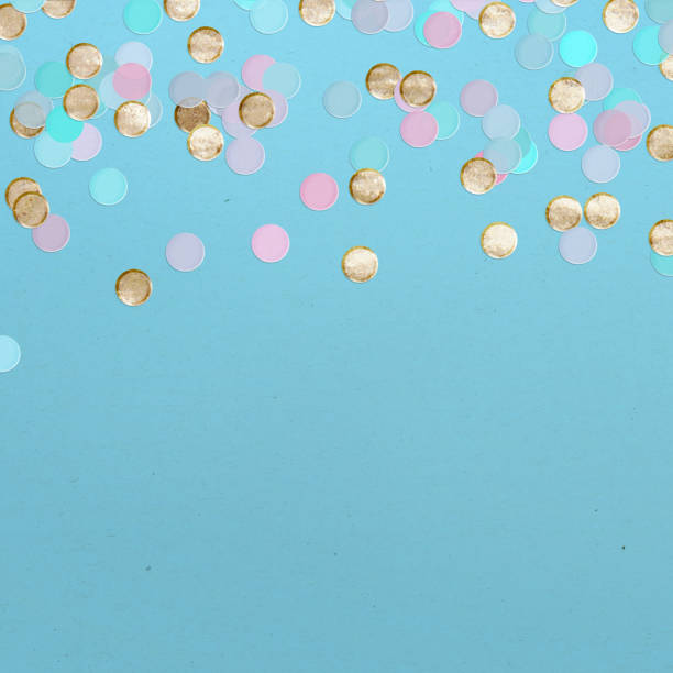 istock Colorful Recycled Confetti on Blue Paper Background 2190233419