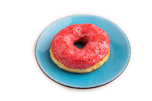 Donut with colorful sprinkles  multi-colored glaze chocolate isolated on white background Sweet colored donut pink glaze red white sprinkles Dessert Top view Close up