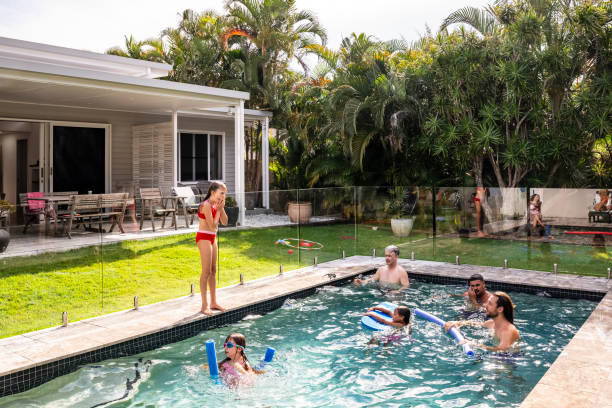 istock Family members playing with noodle floats and bodyboard 2190233704